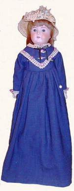 German Bisque Doll, Lissy This German bisque doll with open mouth, named "Lissy," circa 1890, is wearing vintage clothing.