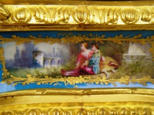 large-antique-figurative-bronze-clock-sevres-porcelain-detail This clock features hand-painted Sevres porcelain inserts