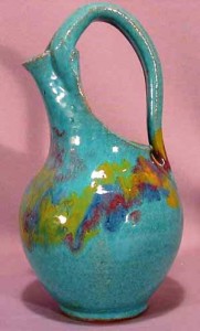 north-carolina-pottery-pitcher-by-rainbow This tall split handled pitcher is covered in a robin’s egg blue glaze with colorful splashes around the shoulder. Believed to be made in the 1930s.