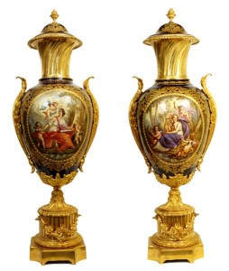 pair-antique-sevres-style-ormolu-bronze-porcelain-urns A monumental pair of porcelain urns measuring 29 inches tall, featuring painted scenes depicting muses on a cobalt blue ground, with the monogram of King Louis Philippe (1773-1850) on the reverse.