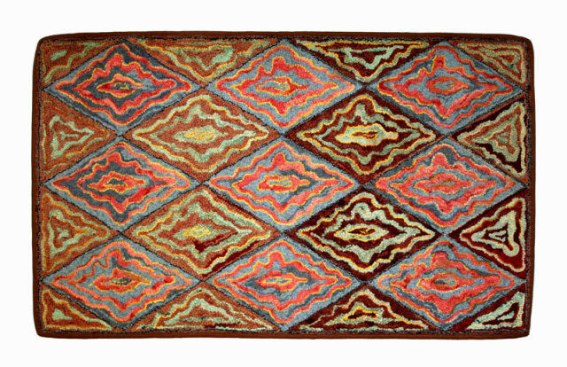 Antique Hooked Rug a Unusual, distinctive, creative, pattern of diamonds and triangles of undulating lines, finely hand hooked, wool on burlap, circa 1920.