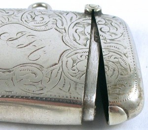 Sterling Match Safe Vesta Engraved With Chatelaine Hoop lid Beautiful scroll work engraving on the front and back of this 19th century match vault. There is a Cartouche in the shape of a shield on the front with initials in fancy English script.