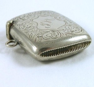 Sterling Match Safe Vesta Engraved With Chatelaine Hoop striker It has a thumb catch on the front top. It has a heavy strong hinge. There is a hoop on the side for attaching to a Châtelaine. The striker still has heavy grooves.