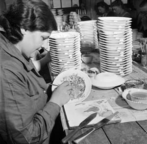 wartime-ceramics-i A ceramics worker paints a design onto a plate with enamel at the J & G Meakin factory in Hanley. These plates were to be exported to South America to generate income for the battered British economy during World War Two.
