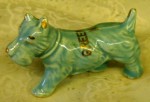 Art Pottery Scotty Dog Figure Greensboro N.C An art pottery Scotty dog figure, with a souvenir promotion for Greensboro N.C. around the center area, circa 1940s.