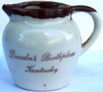 Souvenir Pitcher From Lincoln's Birthplace Kentucky A souvenir pitcher from “Lincoln's Birthplace Kentucky.” The pitcher is 3 inches high and marked “PCA, Hand crafted, made in USA” on bottom.