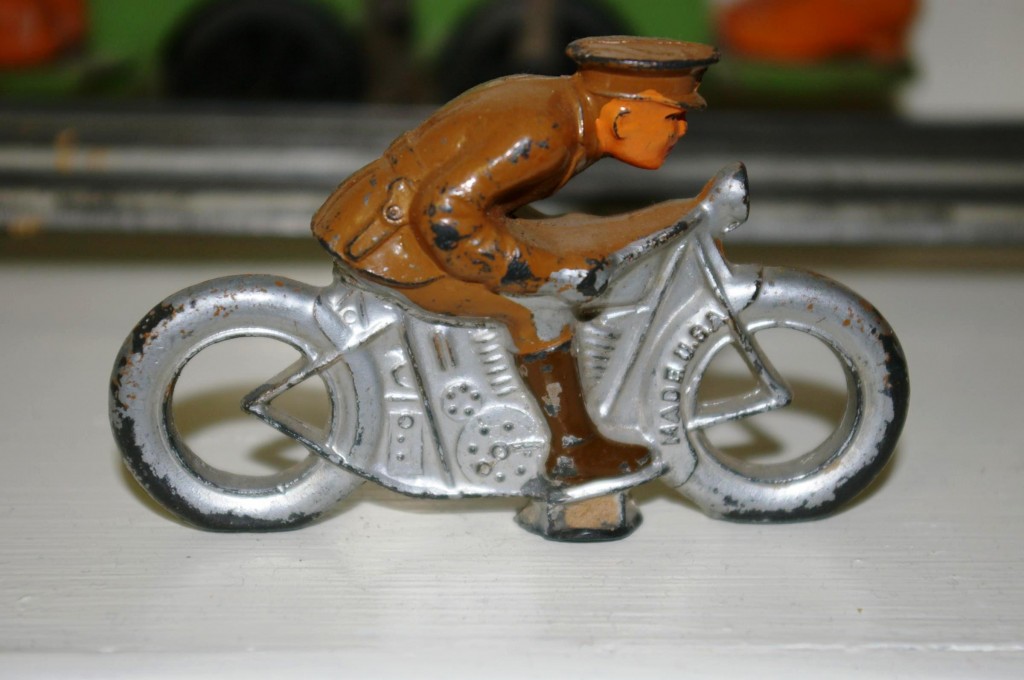 barclay-motorcycle-rider A toy soldier riding a motorcycle made by Barclay, one of the original American toy soldier manufacturers.