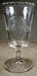 An example of an early American Pattern Glass celery vase. This over-sized goblet with crimped lip, in the Venus & Cupid pattern, was produced by Richards & Hartley between 1875-1884 and by U.S. Glass after 1891.