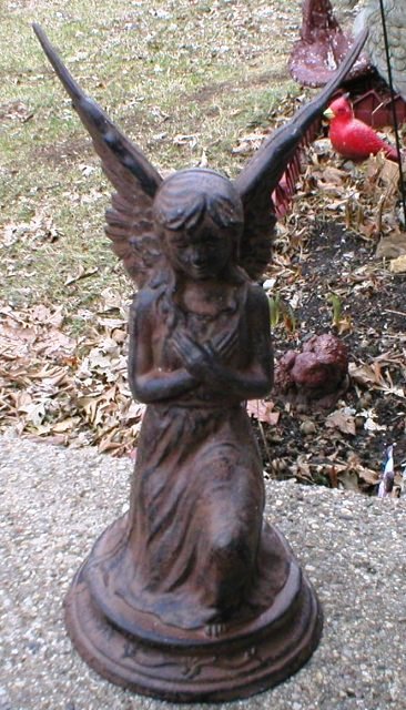 angel-statue-cast-iron-garden-deck-home-decor-a A cast iron angel can add a little touch of art to a garden, but make sure to pay careful attention to the accumulation of surface dirt, grime, lichen, algae or mold.