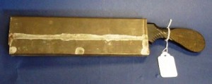 882 This amputation saw was found with the tin "scabbard" protecting the blade, circa 1860.
