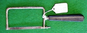 bow-saw This small bow, or metacarpal saw, has a smooth ebony handle.
