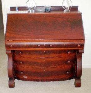 crotch-2 A broader pattern of the book matched crotch cut veneer is seen on the lid and drawer fronts of this early 20th century drop front desk.