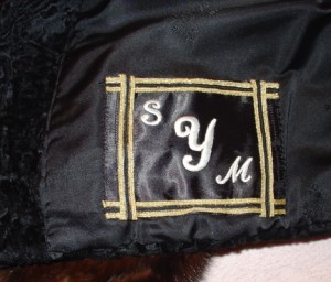 monogram-patch-with-iron-on-initials This fur had a monogram that had been horribly chopped out of the lining, leaving a huge, gaping hole. I used black satin blanket binding from the sewing store to make a patch and put my own monogram on it.