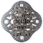lid Stove Trivet: "Slow Cooking Cover," 7" diameter, late 1800s; value $45