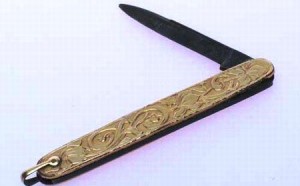 keen-pen-knife The gold washed exterior of this vintage pen knife is elaborately engraved with fanciful scroll and floral work. The smaller of its two blades is marked "Keene New York M.I. Germany."