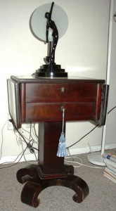 table If this old Empire Revival table is not strong enough to support the lamp, be prepared to: 1) properly repair the table; 2) replace the table, or; 3) replace the lamp.