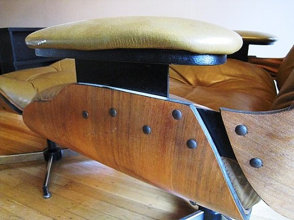 fakeeames2 Charles and Ray Eames were looking for a seamless look, without any visible hardware. The real chair is held together with rubber shock-mounts glued to the wood under the cushions. If you see screws, it’s a knock-off.