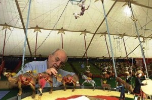 howard-tibbals Philanthropist and model builder Howard Tibbals puts the finishing touches on the Howard Bros. Circus, the largest miniature circus in the world. The circus is now on permanent display in the Ringling Circus Museum's Tibbals Learning Center.