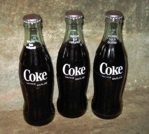 bottles-with-coke-still-inside-1970s Bottles with Coke still inside, 1970s