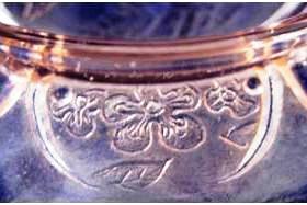 cherry-blossom-vii The flowers on rim of this reproduction butter dish base again look as if they were drawn by a child.