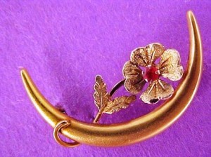 gold-victorian-crescent-honeymoon-floral-ruby-pin An early Victorian Honeymoon pin 10k yellow-gold with a tiny genuine ruby prong set in middle of flower.