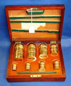 81134b DeGrave Short and Co. apothecaries measures in their mahogany box.