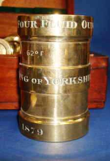 81134d Close up of the marks on the apothecaries measures. The dates range from 1879 to 1949.