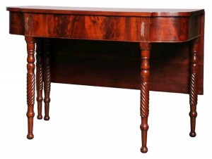 federal-table The end of a D-end Federal period banquet table shows the influence of Thomas Sheraton in the tapered legs.