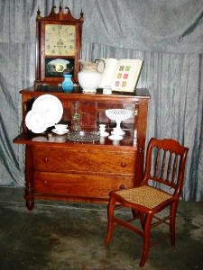 group-1 Items to be sold include a Seth Thomas mantle clock with painted reserve and a butler's chest with desk drawer.