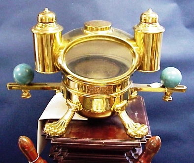 3-4-39a Fancy yacht binnacle with compensating balls and lanterns and decorative lion feet.