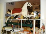 hobby-horse-and-toys A hobby horse from the 19th century on a sliding base, surrounded by many collectible toys, will be sold.