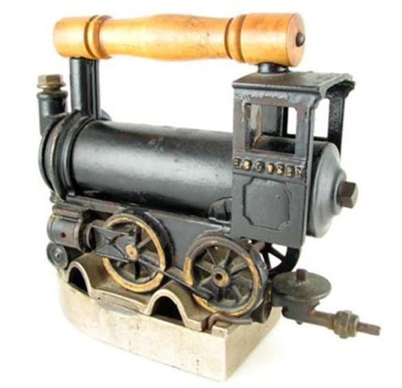 locomotive-iron-2 Filed with alcohol fuel, Marilyn’s locomotive-shaped steam iron would weigh in at a more than 10 pounds, and would have taken a woman with biceps like Popeye’s to use it.