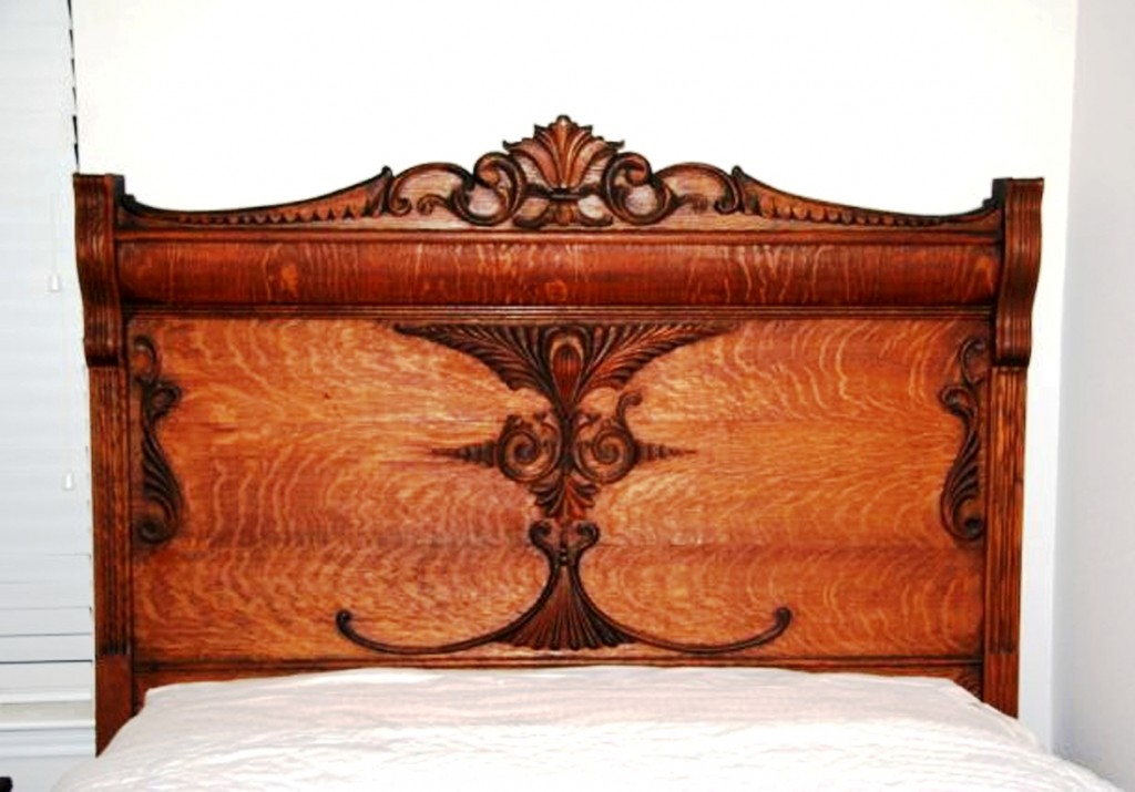 oak-bed The tag says “Hand-carved oak headboard...” The tiny nails in the “carvings” attest to the fact that they are applied molding.