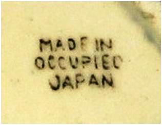 oj-fig-1 MIOJ black ink stamp. The color is not significant and has no bearing on the value of the item. The unevenness of the letters is typical and appears in nearly all OJ marks.
