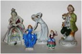oj-fig-3 A group of OJ Glazed Porcelain figurines, from three to six inches tall, in period dress from the 17th century right up to modern day at the time (i.e. 1950s).