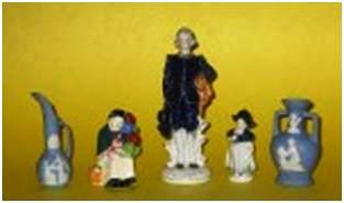 oj-fig-6 Examples of the OJ figurines that copy other potter’s designs. The Royal Doulton copy of the balloon lady is only 3 ½ inches tall, while the Wedgwood copies are 4 inches tall. The Delft-like girl is 3 ½ inches tall, and the boy, often called “Blue Boy,” is 7 inches tall.