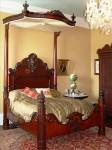 plantation-bed Rosewood queen-size half tester plantation bed signed by C. Lee.