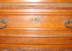 This turn of the 20th century bookcase drawer has a very unusual Star of David escutcheon.