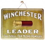 winchester-brass-sign An extremely rare Winchester Leader “The Shell for Nitro Powders” brass embossed sign sold for $2,500.