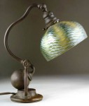 Tiffany This Tiffany Studios counterbalance desk lamp with bronze base and green damascene shade brought $8,050.