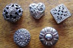 button-cover-vintage-metal-filigree-flower-silver-tones Vintage metal button covers featuring filigree flower in silver tones, circa 1940.
