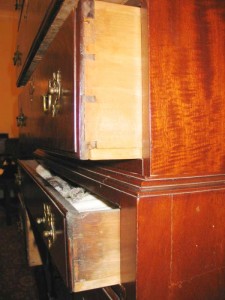 The drawer sides of the bottom section of this chest on chest do not match those of the upper section, indicating a possible marriage.