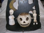 DSCN0329 Another example of an early Halloween decoration. The ghost on the left has a head that bobs on a spring and the candy drawer is inset under his feet.
