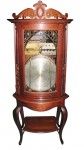 Regina bowfront This Regina bowfront changer antique music box in a rare oak case sold for $19,550.