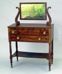 Mahogany dresser This well-crafted early 19th century American mahogany dresser with lyre carved supported mirror brought $1,840.