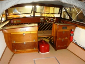Motorboat Interior view of a white 1966 wooden Grady White motorboat with trailer, in excellent condition.