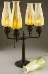 Tiffany lamp A Tiffany Studios bronze and favrile glass lamp, four-arm electrified candelabra form, should gavel down for between $5,000 and $8,000.