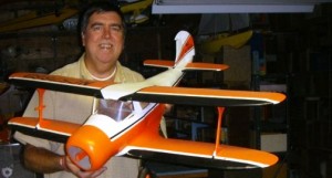 Tim with plane Tim Chapulis of Tim's, Inc.—auctioneer for the event—with one of several hundred model airplanes from a massive single-owner lifetime collection that will be auctioned on Dec. 6.