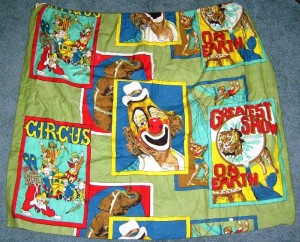 gsoebag This cloth material was sold by the yard but the manufacturer failed to get a licensing agreement with The Greatest Show On Earth. It was soon pulled and the design was altered to remove the words “The Greatest Show On Earth” and the famous Ringling clown image of Lou Jacobs. One yard of the original unlicensed material sold on eBay in 2008 for $10.