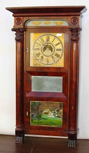 C & N Jerome A 39-inch 8-day repeating brass clock labeled “C & N Jerome” with scored dial.